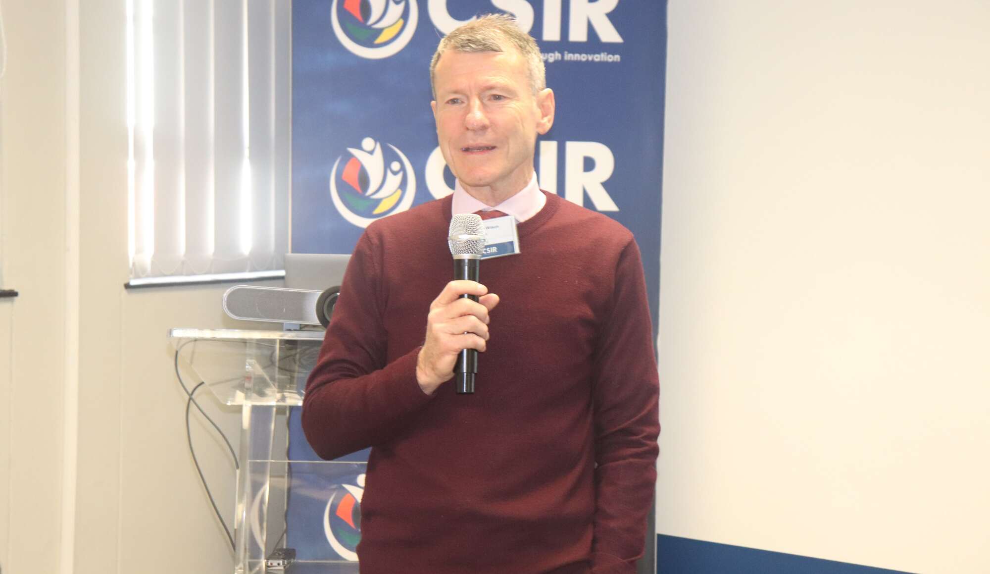 Person holding a mic