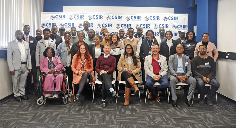 People sitting for a team picture