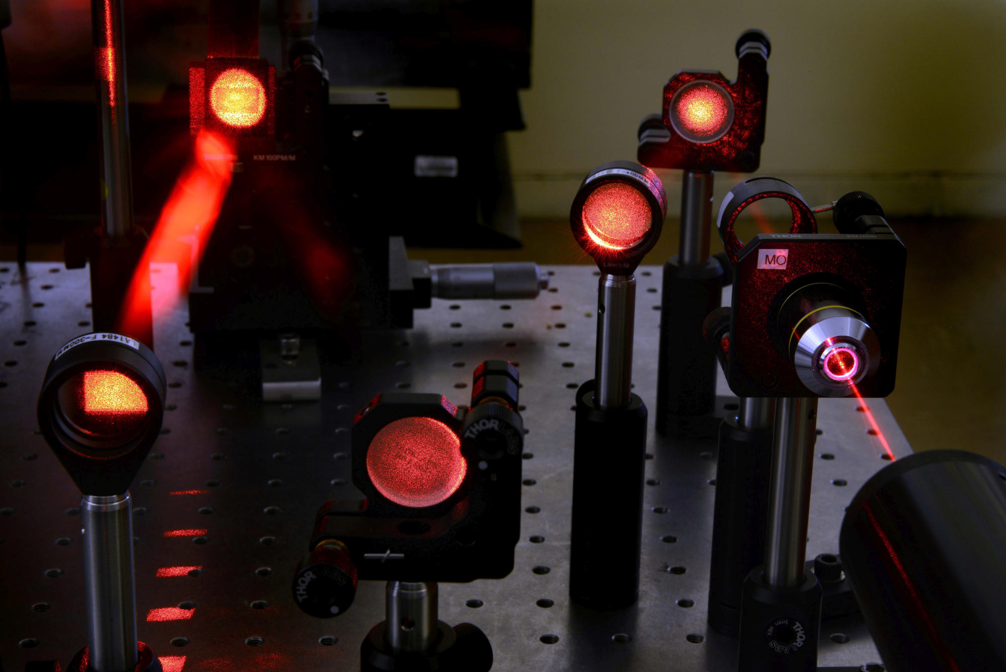 Hand holding a container with yellowish liquid