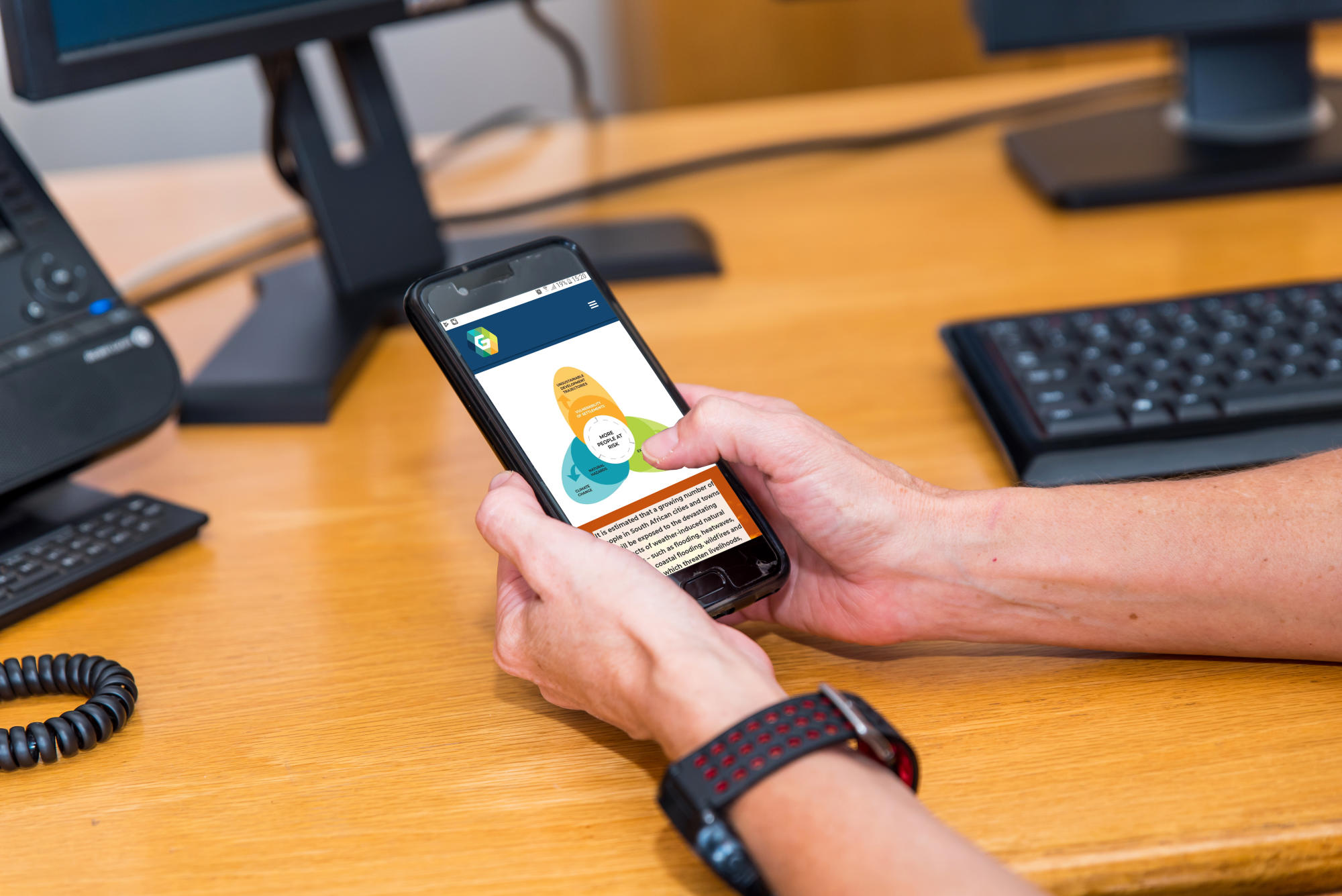 Hand holding a container with yellowish liquid