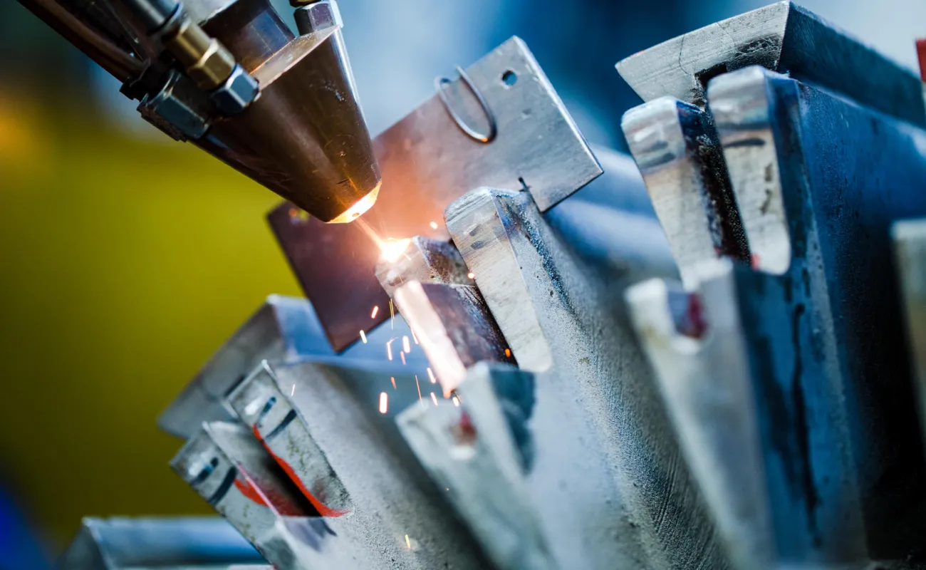 Hand holding a container with yellowish liquid