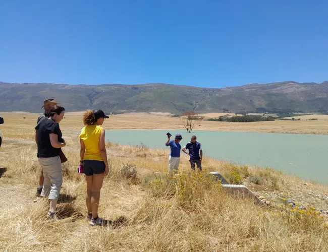 People looking at a body of water